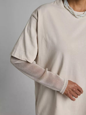 Oversized tee in Camel with sheer, metallic long sleeves layered underneath.