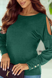 Dark green long sleeve top with shoulder cutouts and button cuffs
