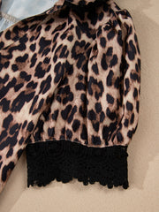 Women's leopard print shirt with black lace trim detail.
