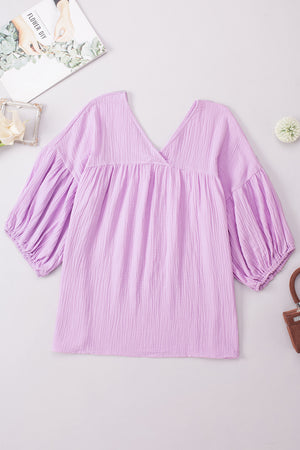 Textured gauze blouse in Heliotrope Purple with V-neck and gathered balloon sleeves.