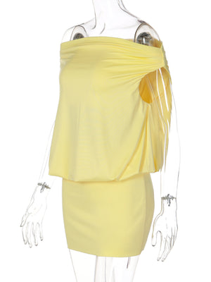 Yellow off-shoulder ruched mini dress with draped detail and sweetheart neckline.