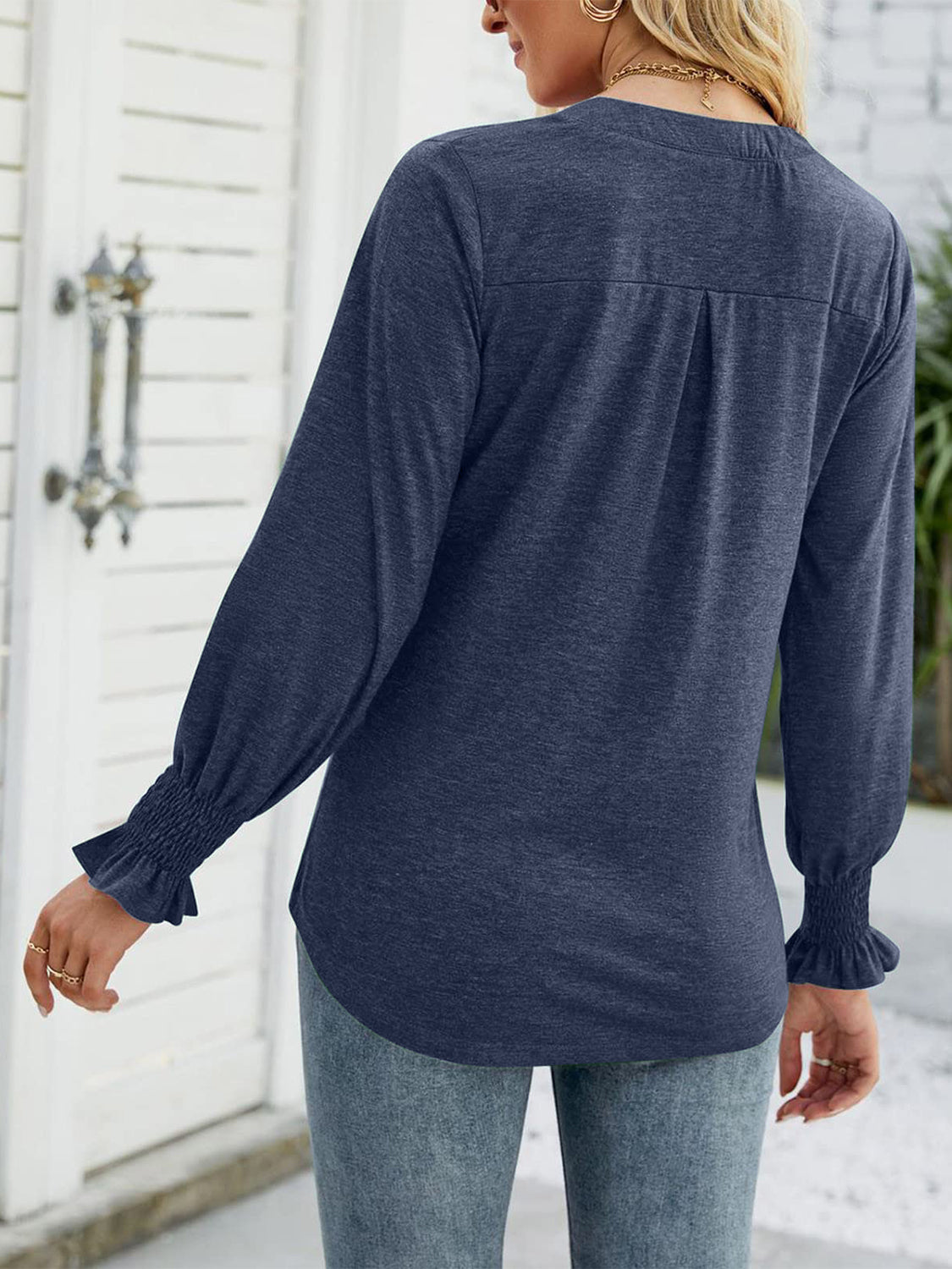 Gathered cuff v-neck jersey top in indigo with ruched sleeves and back pleats.