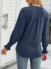 Gathered cuff v-neck jersey top in indigo with ruched sleeves and back pleats.