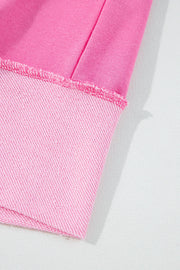 Fuchsia pink cotton loungewear set with contrast trim and raw edge detail.