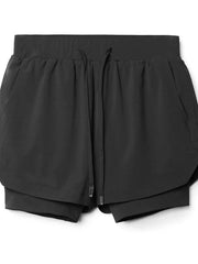 Black layered performance shorts with drawstring and perforated panels.