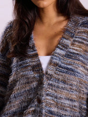 Cozy textured knit cardigan in blue and brown marled yarn with fuzzy fringe detail and button front.