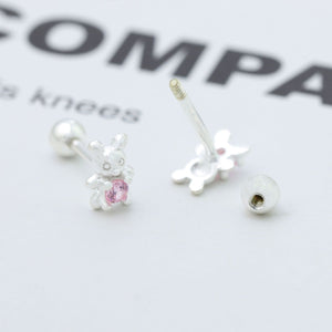 Silver bear stud earrings with pink zircon stone detail.