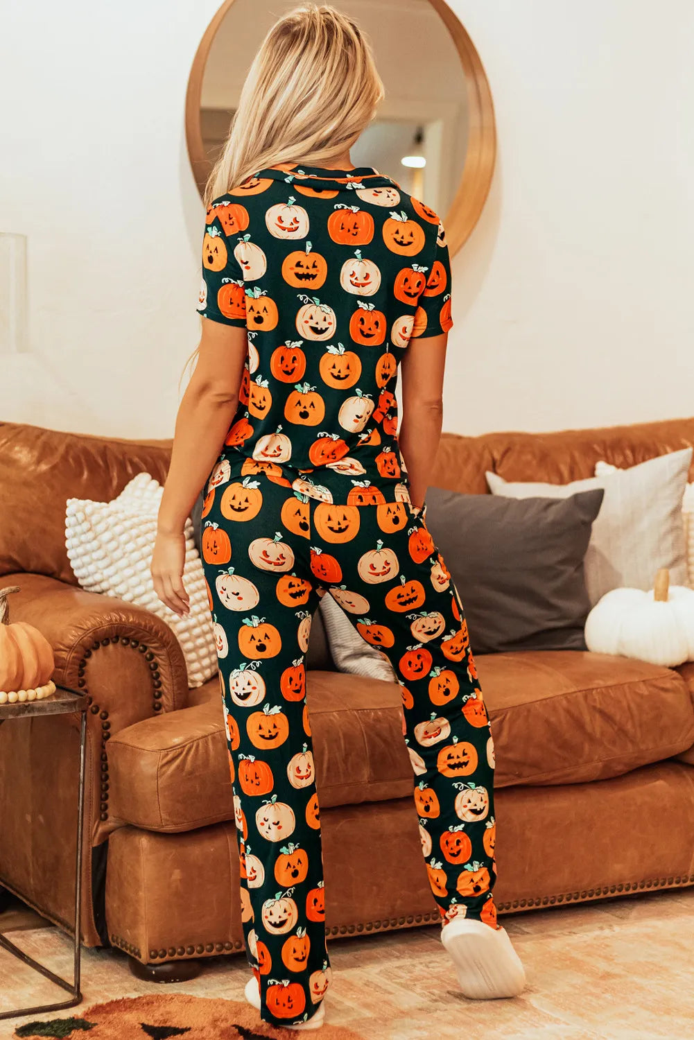Adult pumpkin patch pajama set with short sleeves and pants in orange and black.