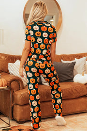 Adult pumpkin patch pajama set with short sleeves and pants in orange and black.