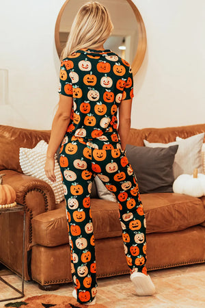 Adult pumpkin patch pajama set with short sleeves and pants in orange and black.