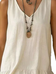 White tiered ruffled hem v-neck dress with a layered necklace