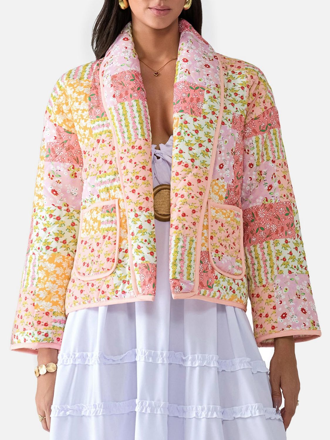 Floral quilted patchwork jacket in pink and orange with a shawl collar and patch pockets.
