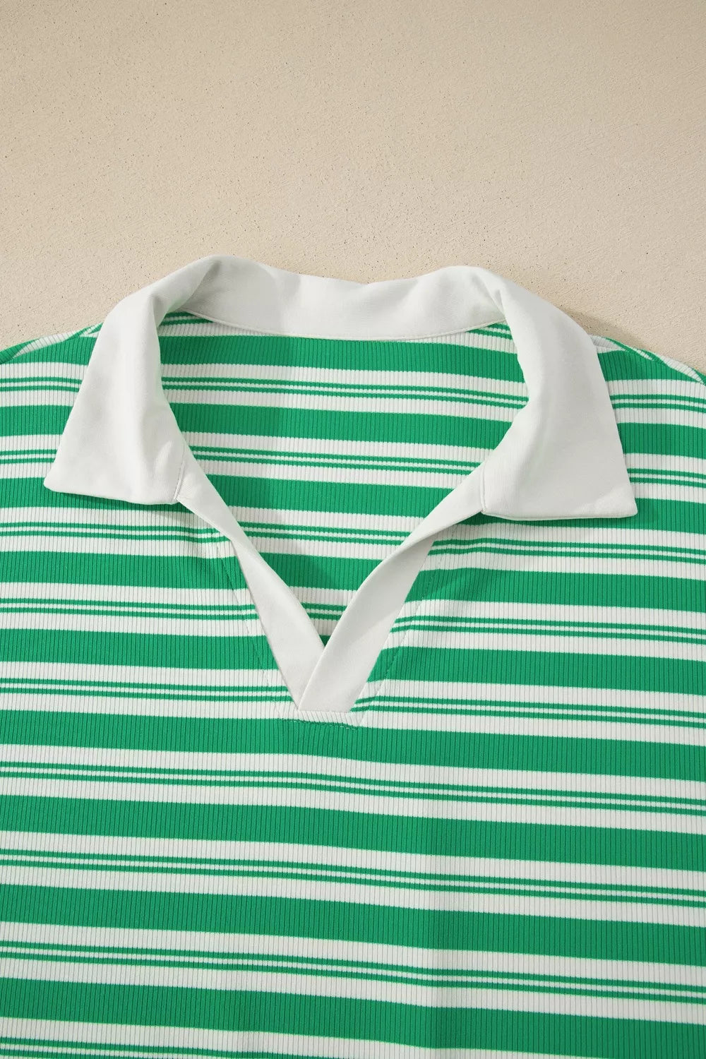 Green and white striped midi dress with collared V-neck and white trim