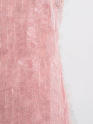 Pink iridescent sequin halter mini dress with mesh overlay and circular sequin details.
