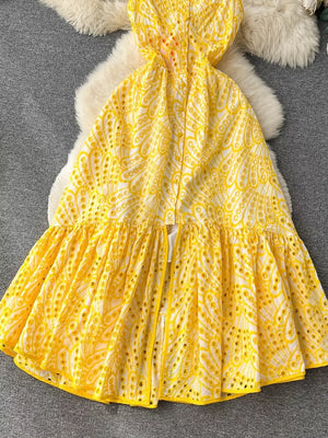 Yellow lace-embroidered tiered cami dress with eyelet detail and ruffled hem.