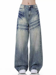 Men's vintage distressed wide-leg jeans in light blue cotton with faded wash and whiskering.
