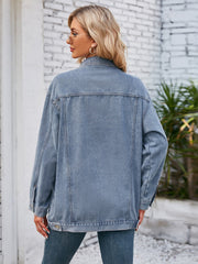 Oversized Dusty Blue denim trucker jacket with rolled sleeves and button details.