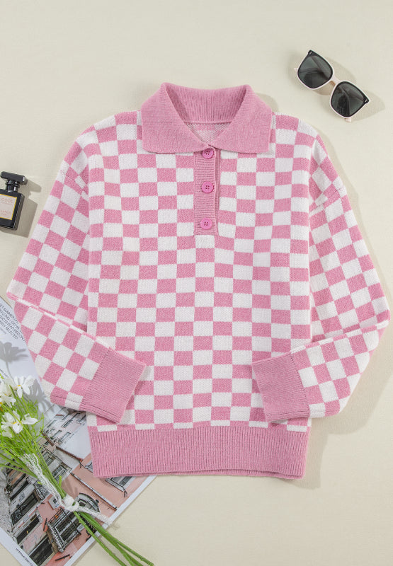 Pink checkerboard knit polo sweater with button detail and ribbed cuffs and hem