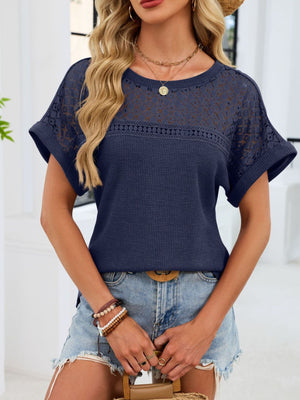 Navy blue waffle knit t-shirt with eyelet detail on sleeves and yoke.