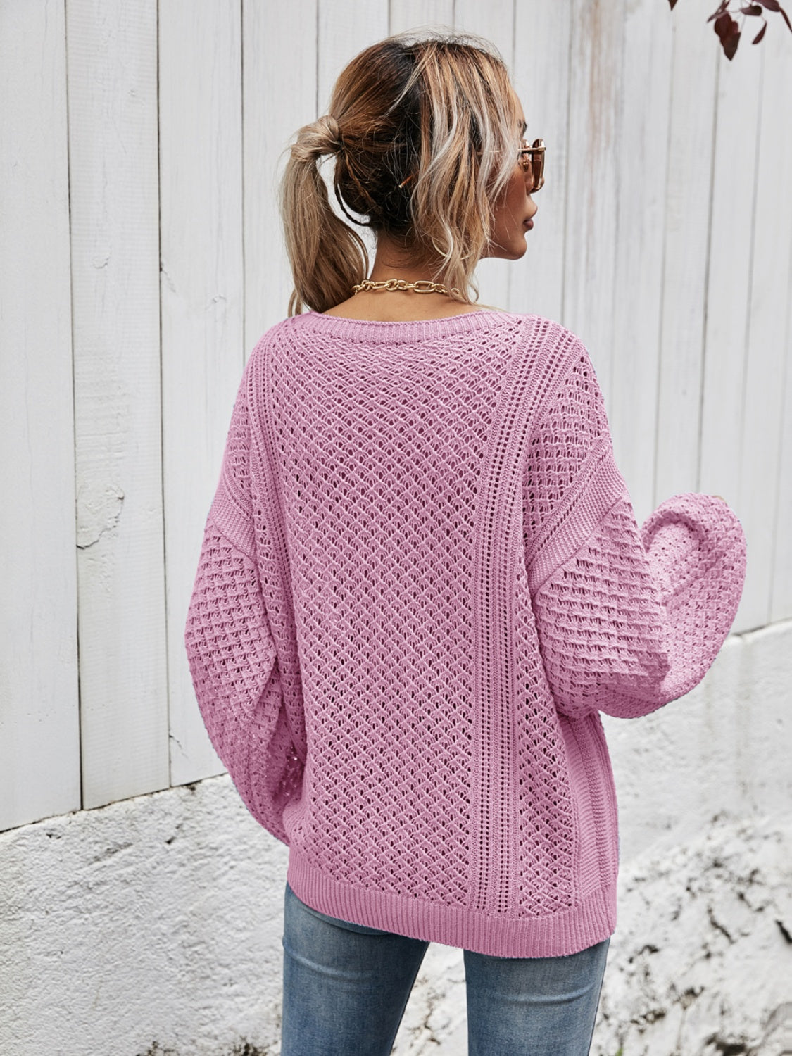 Open-knit sweater in Moonlit Mauve with balloon sleeves and a relaxed fit.