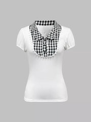 White maternity shirt with black gingham collar, lace trim, and decorative buttons.