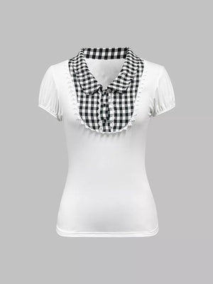 White maternity shirt with black gingham collar, lace trim, and decorative buttons.