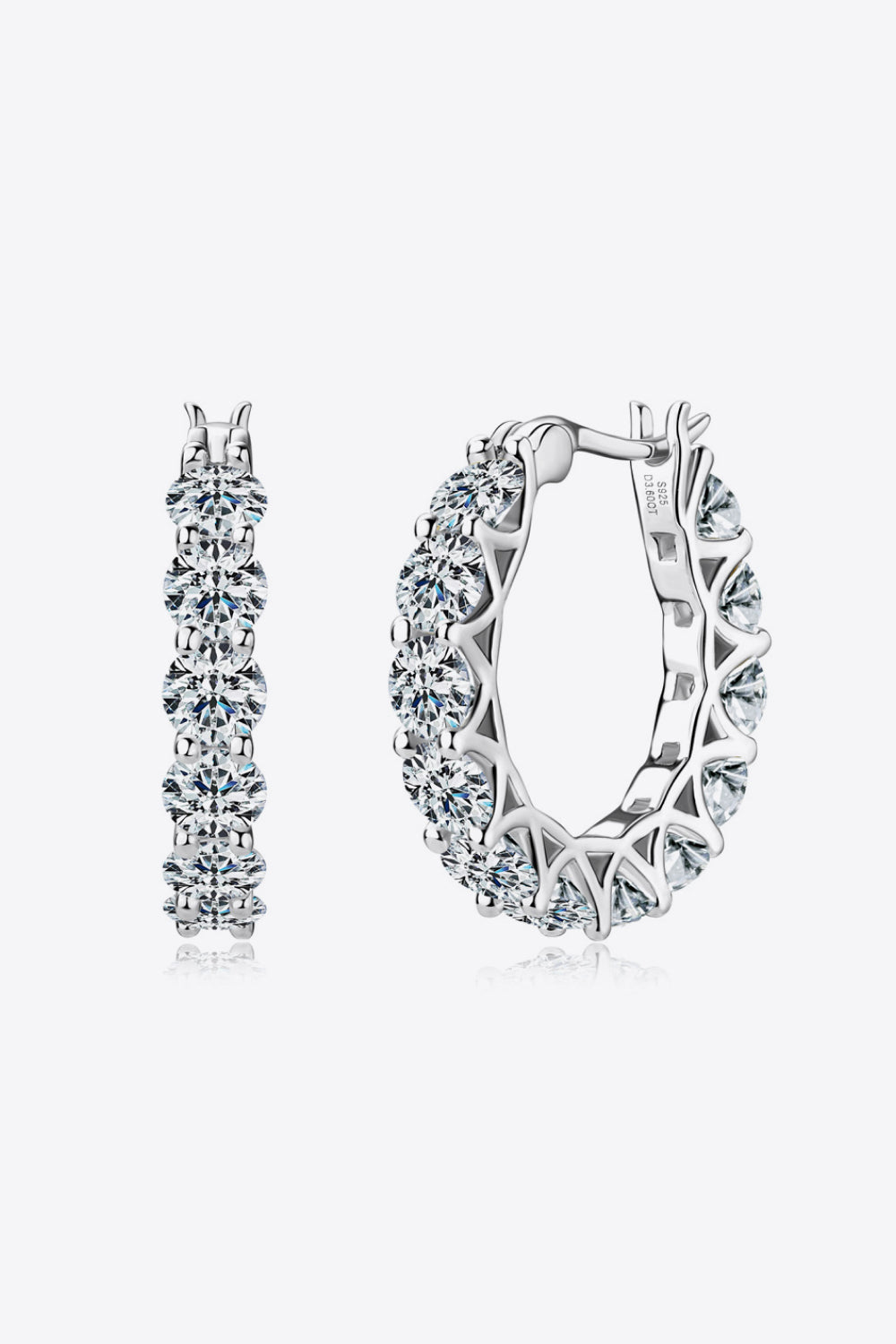 Silver moissanite pavé hoop earrings with sparkling round-cut stones.