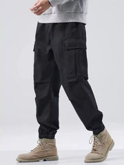 Black relaxed fit cargo sweatpants with elastic cuffs and multiple pockets.