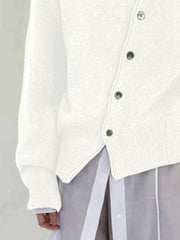 White knit cardigan with asymmetric button closure and ribbed cuffs and hem