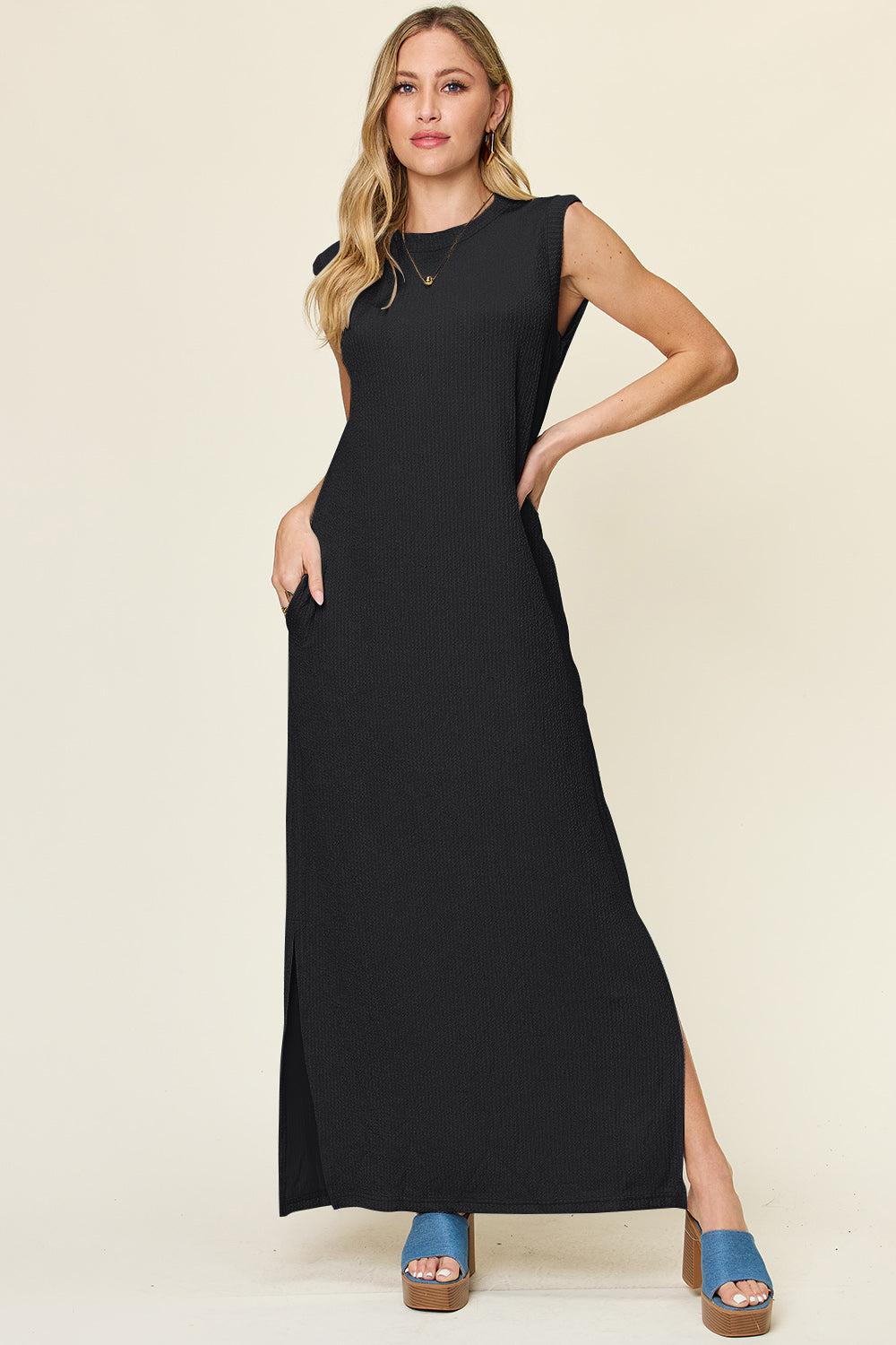 Black ribbed maxi dress with side slits and pockets