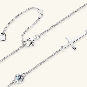 Silver asymmetrical cross pendant necklace with cubic zirconia and heart charm
