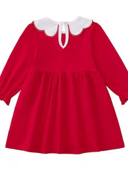 Red baby dress with white scalloped collar and long sleeves.