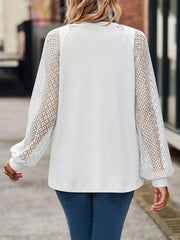 White waffle knit cardigan with lace inset sleeves and a relaxed fit.