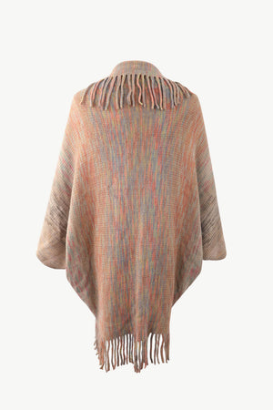 Textured stripe fringe cape in tan with multicolor yarn and fringe details.