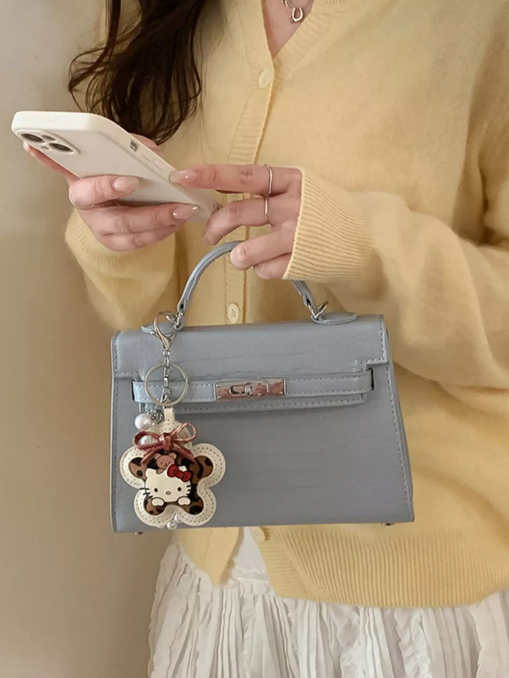Croc-embossed Top-handle Crossbody Bag in Blue, model styling view