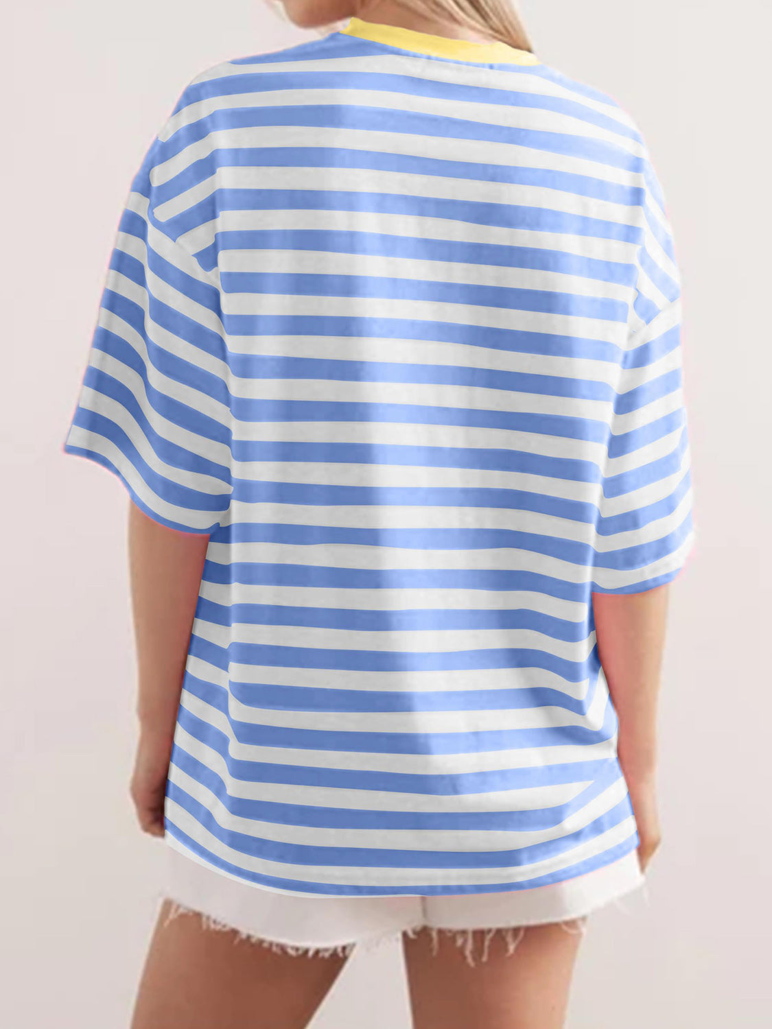 Oversized striped tee with dropped sleeves in Dusty Blue and white stripes, yellow neckline detail.