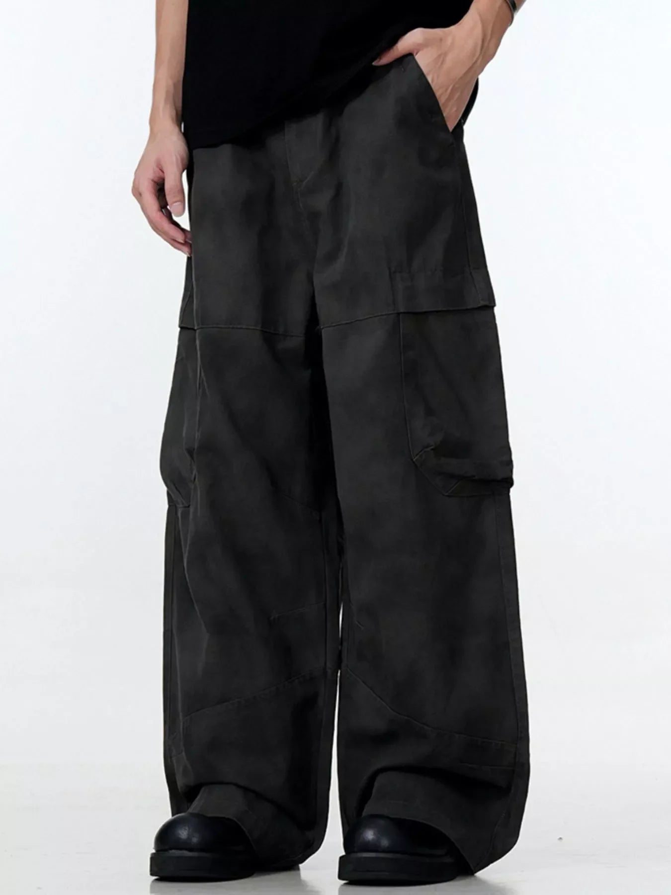 Relaxed fit black cargo pants with multiple pockets and a wide leg.