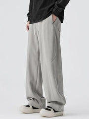 Light gray jogger pants with drawstring and relaxed fit.