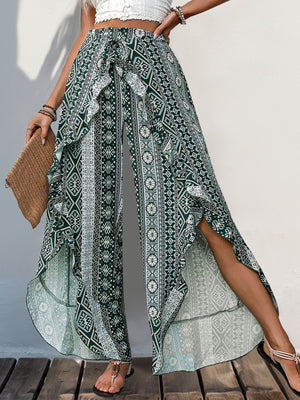 Geometric print palazzo pants in Air Force Blue with ruffle trim and high slits.