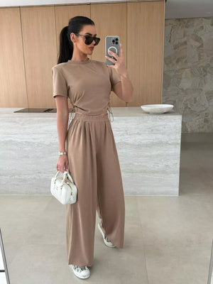 Mocha crop top with drawstring sides and wide-leg pants set.