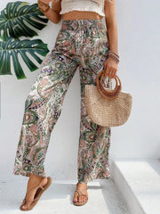Paisley palazzo trousers with drawstring waist in multicolor, featuring a wide leg and boho print.