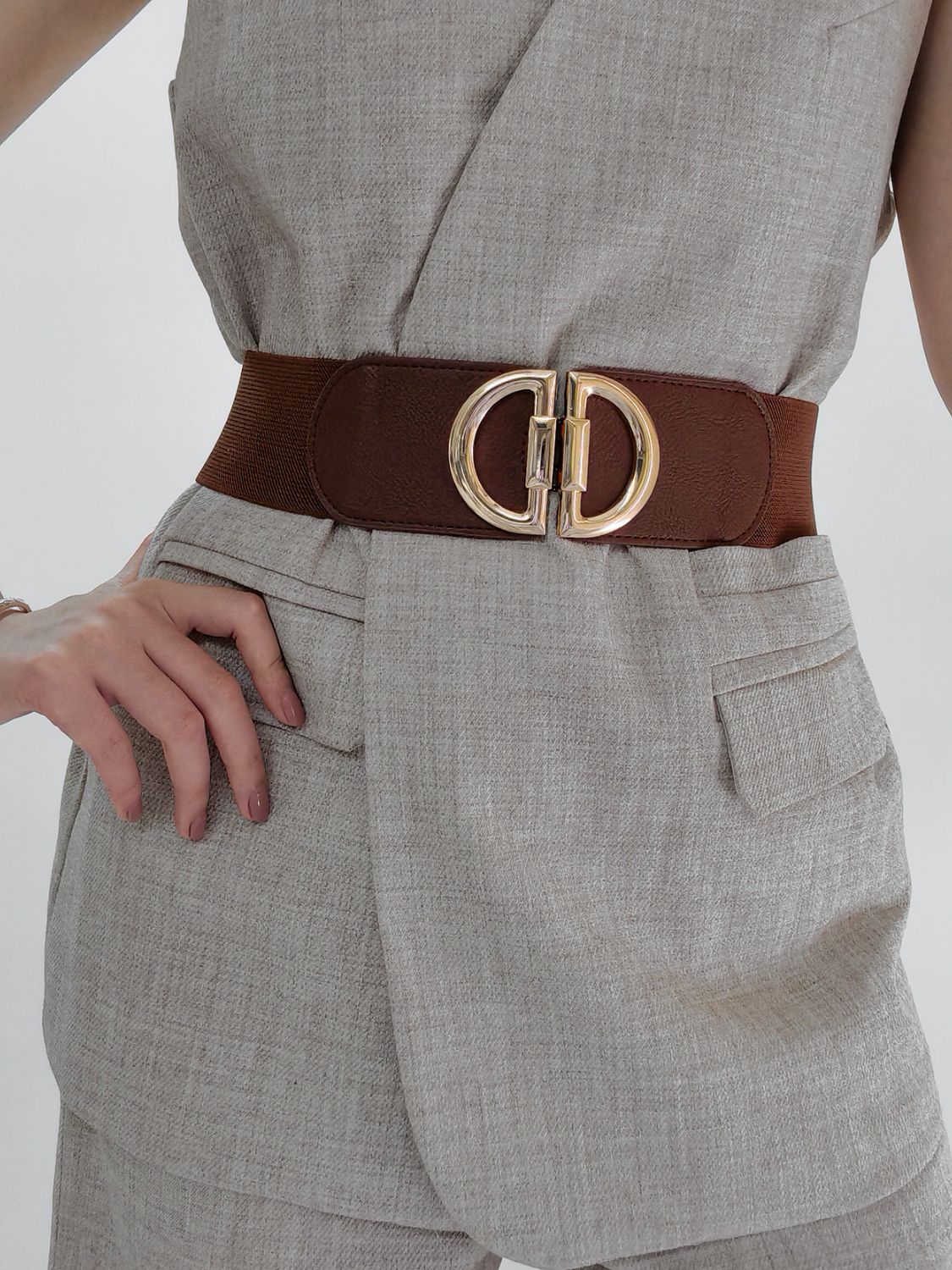 Brown elastic waist belt with double D gold buckle