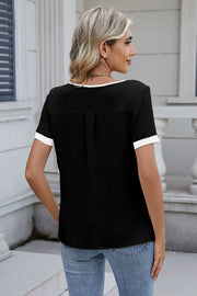 Black short sleeve blouse with contrast trim and textured fabric