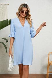 Sky blue V-neck shift dress with flutter sleeves and a relaxed fit.