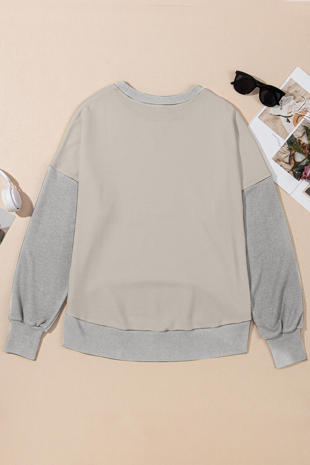 Chic Contrast Crewneck Sweatshirt in tan with gray sleeves and ribbed cuffs.