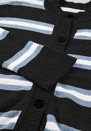 Black knit cardigan with white and blue stripes and button front.