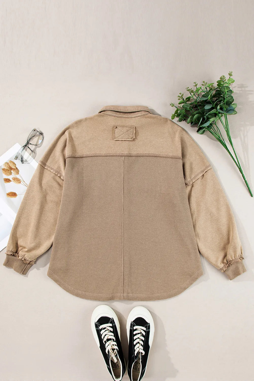 Tan waffle knit overshirt with patch detail on back yoke and ribbed cuffs.