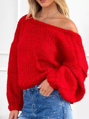 Scarlet chunky knit cardigan with off-the-shoulder neckline and balloon sleeves.