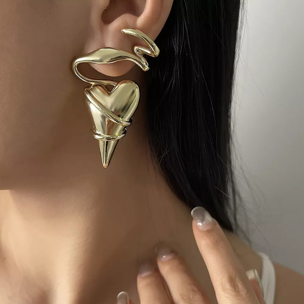 Gold twisted heart wire earrings with luxe finish.