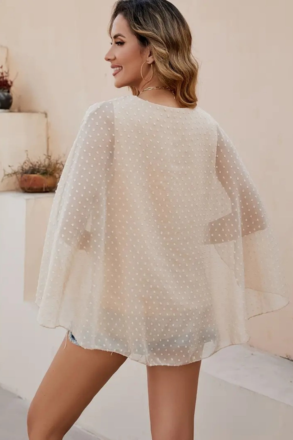 Dotted Swiss cape sleeve blouse in khaki with a sheer overlay.